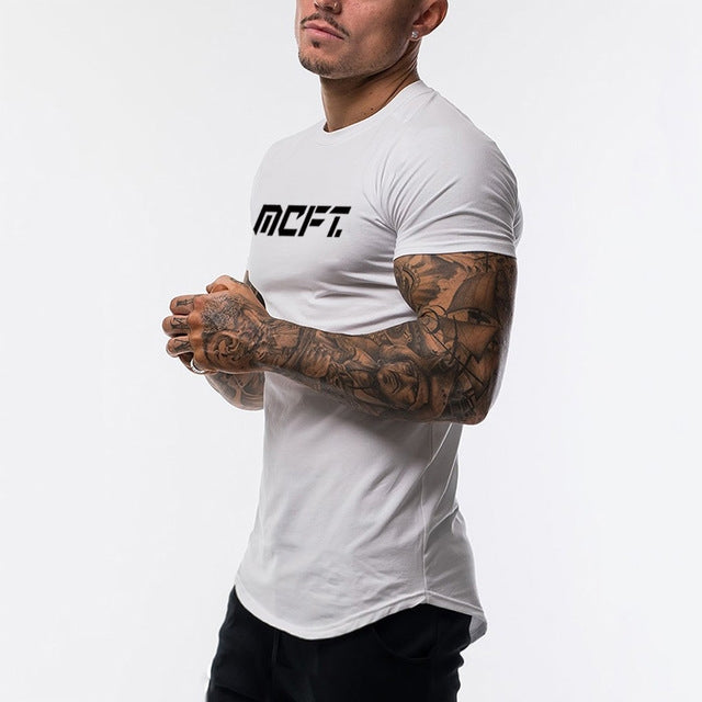 The Vanguard-Core Muscle-Fit Tee with Architectural Curved-Hem & Kinetic-Sleeve