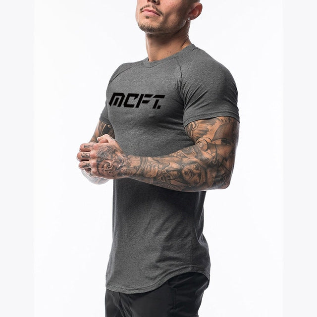The Vanguard-Core Muscle-Fit Tee with Architectural Curved-Hem & Kinetic-Sleeve