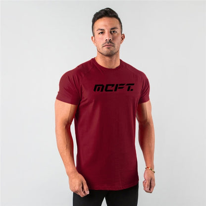 The Vanguard-Core Muscle-Fit Tee with Architectural Curved-Hem & Kinetic-Sleeve